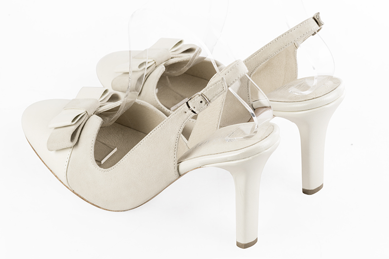 Off white women's open back shoes, with a knot. Round toe. Very high slim heel. Rear view - Florence KOOIJMAN
